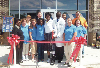 Dr. Bada was joined for the occasion by his mother, Janet Bada, far left, and on the back row, from left, Lynn Edwards, executive director of the Anson County Chamber of Commerce, Wadesboro Mayor Bill Thacker, special guest speaker, Dr. Fidelis Edosomwan from Americare, and Todd Moore, Chamber board chairman.